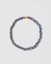  Braided Seed Pearl Choker on light color background.