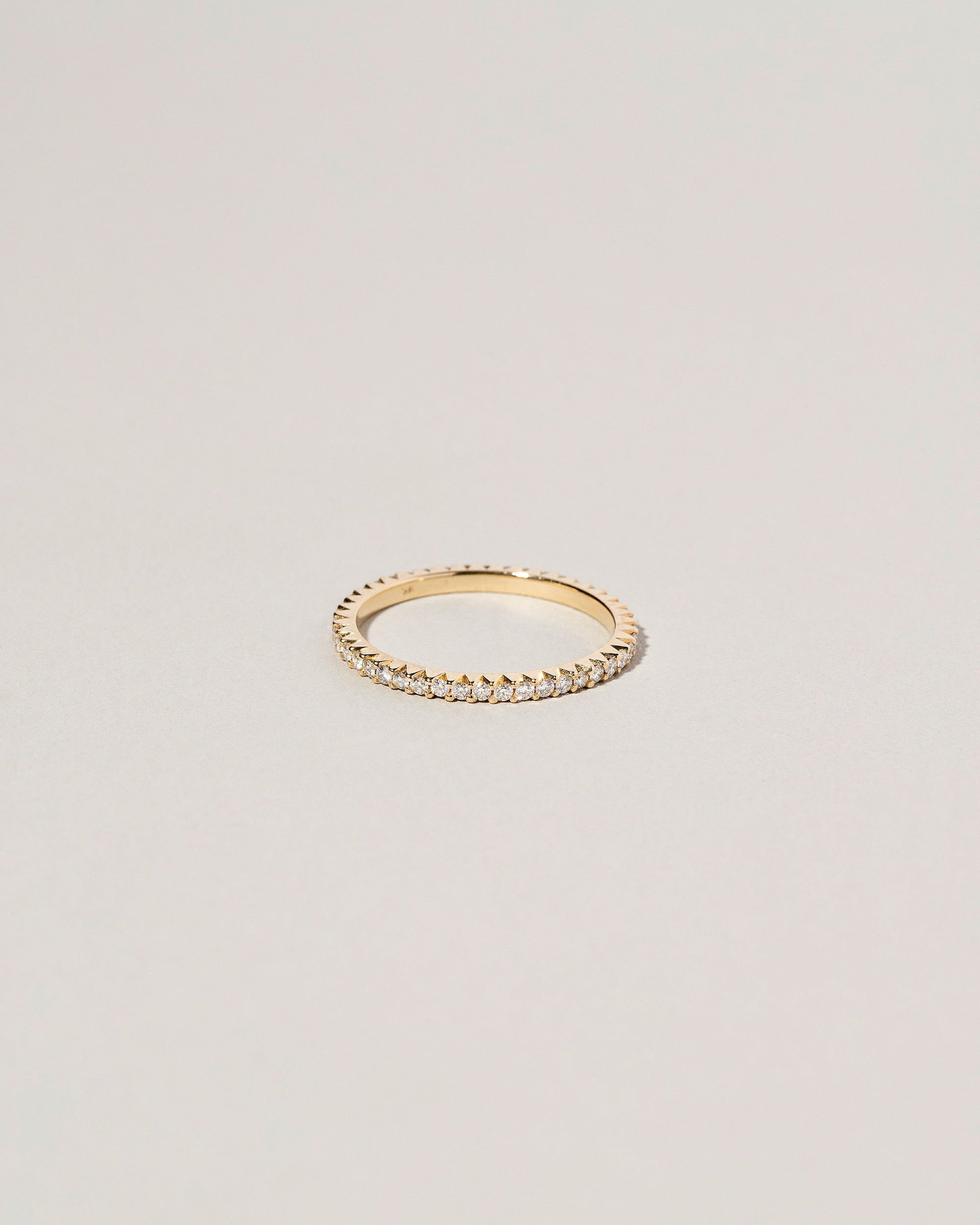 Gold White Diamond Gear Edge Band on light color background.