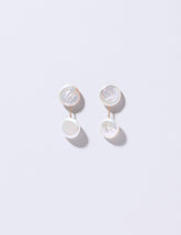  Atlas Earrings on light color background.