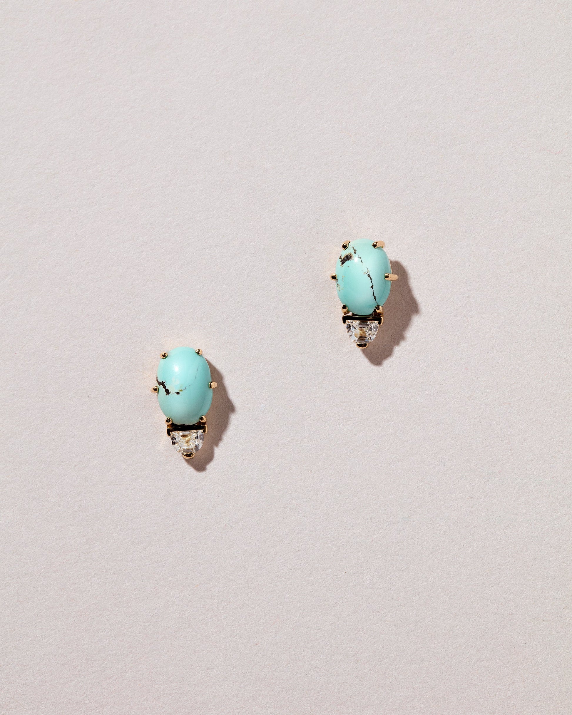  Divine Protection Earrings on light color background.