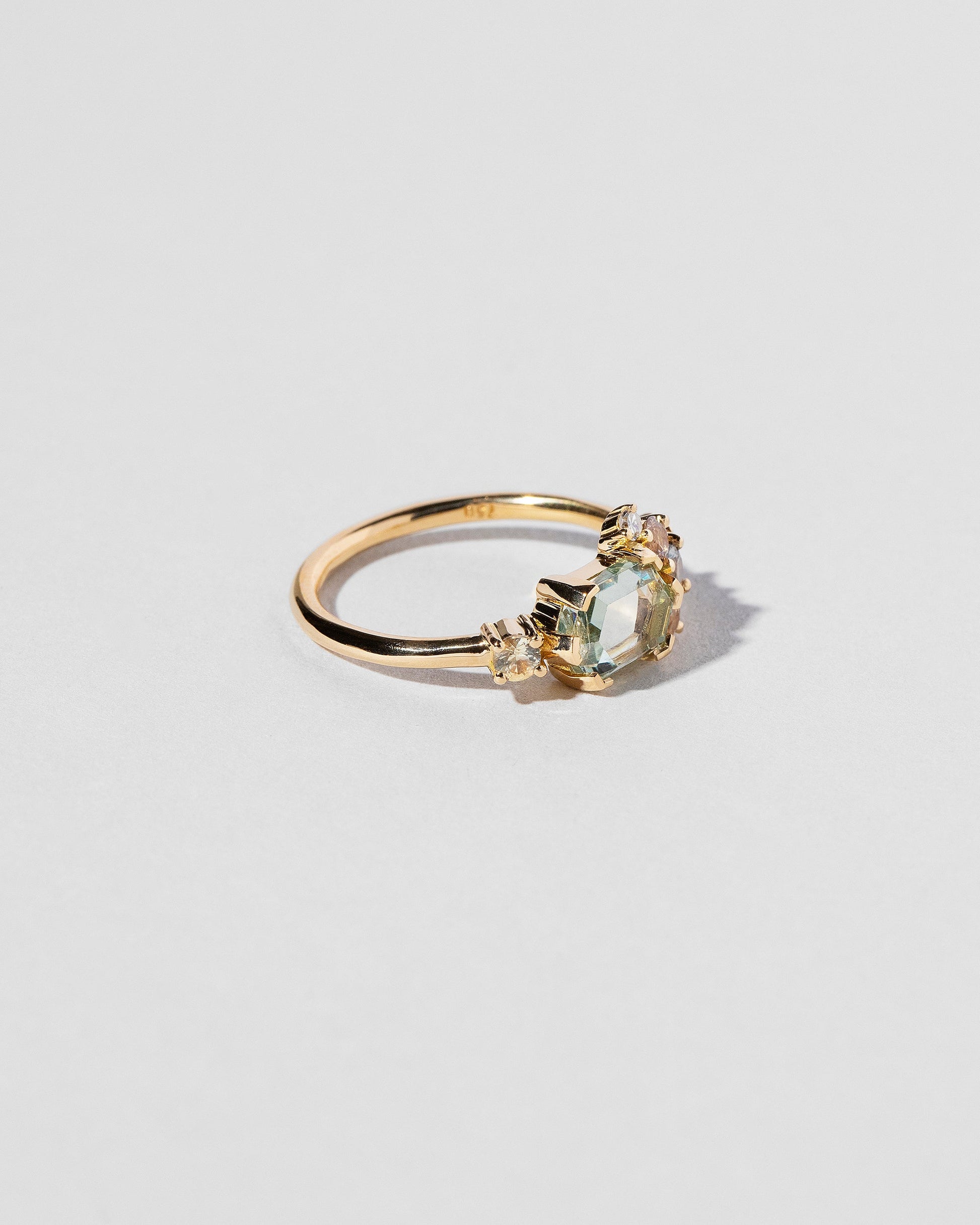  Hexagonal Slice Sapphire Cluster Ring on light color background.