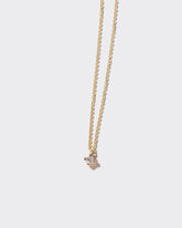  Brille Necklace on light color background.