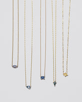 Group of Gemstone Necklaces on light colored background.