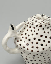 Closeup detail of the Eleonor Boström Spotty Coffee Pot Dogs on light color background.