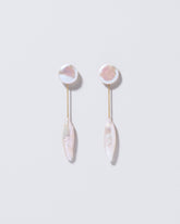  Triton Earrings on light color background.