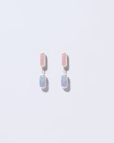  Neleus Earrings on light color background.