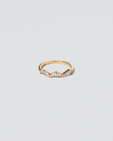 White Diamond Baguette Yellow Gold Zig Zag Band on light color background.