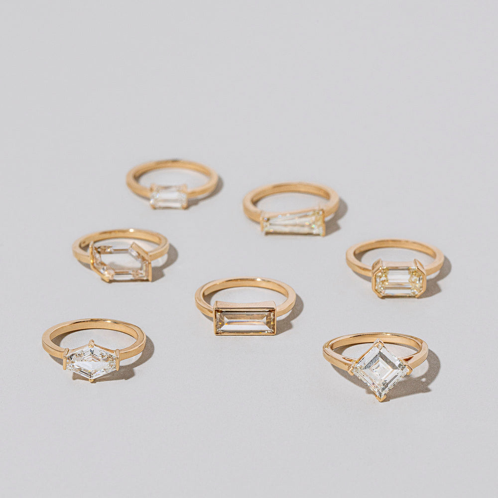 product_details::Group of Seasons Rings on light color background.
