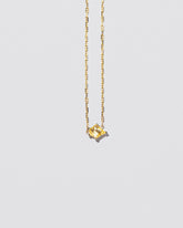  Be Good Necklace on light color background.