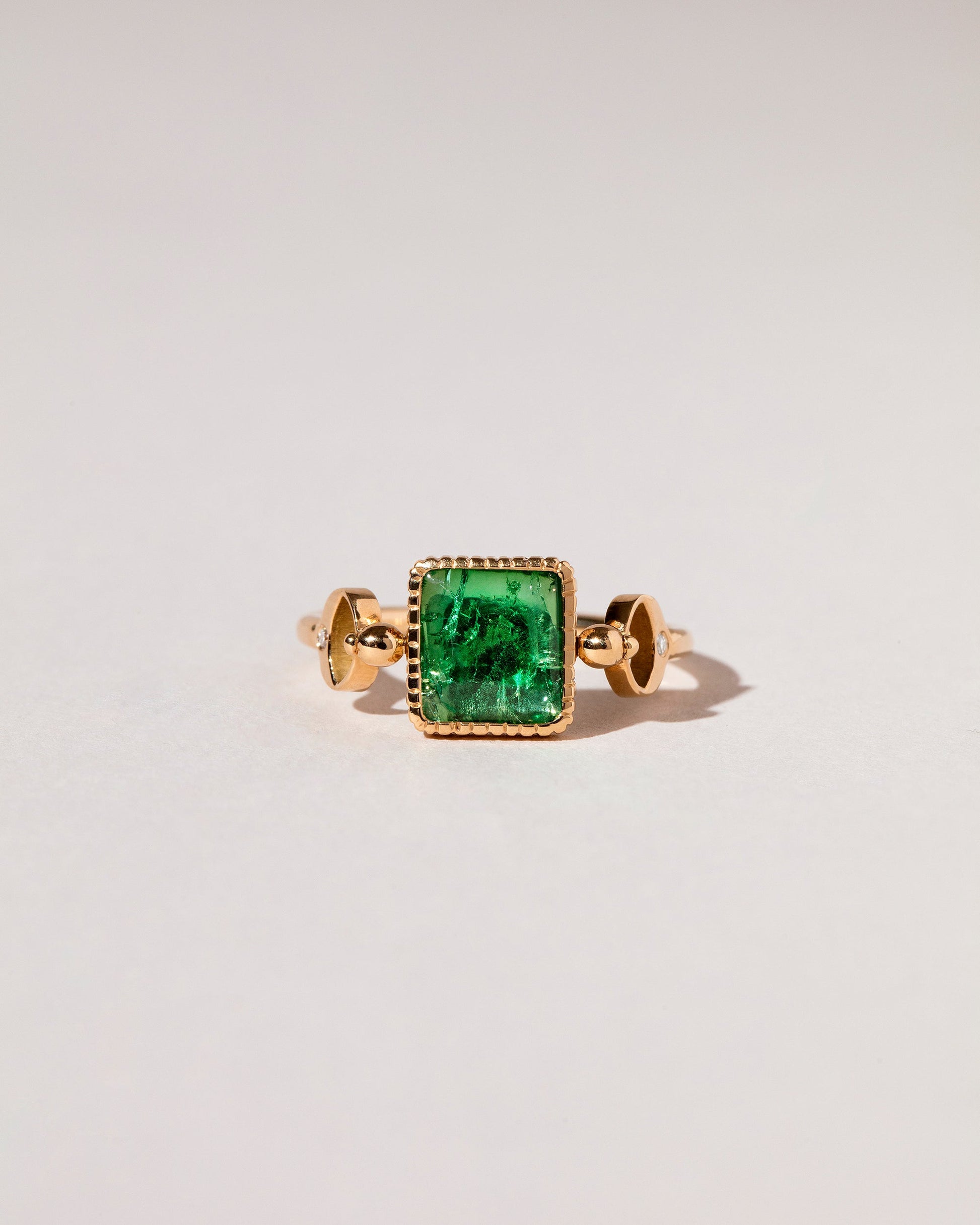  Emerald Moon Ring on light color background.