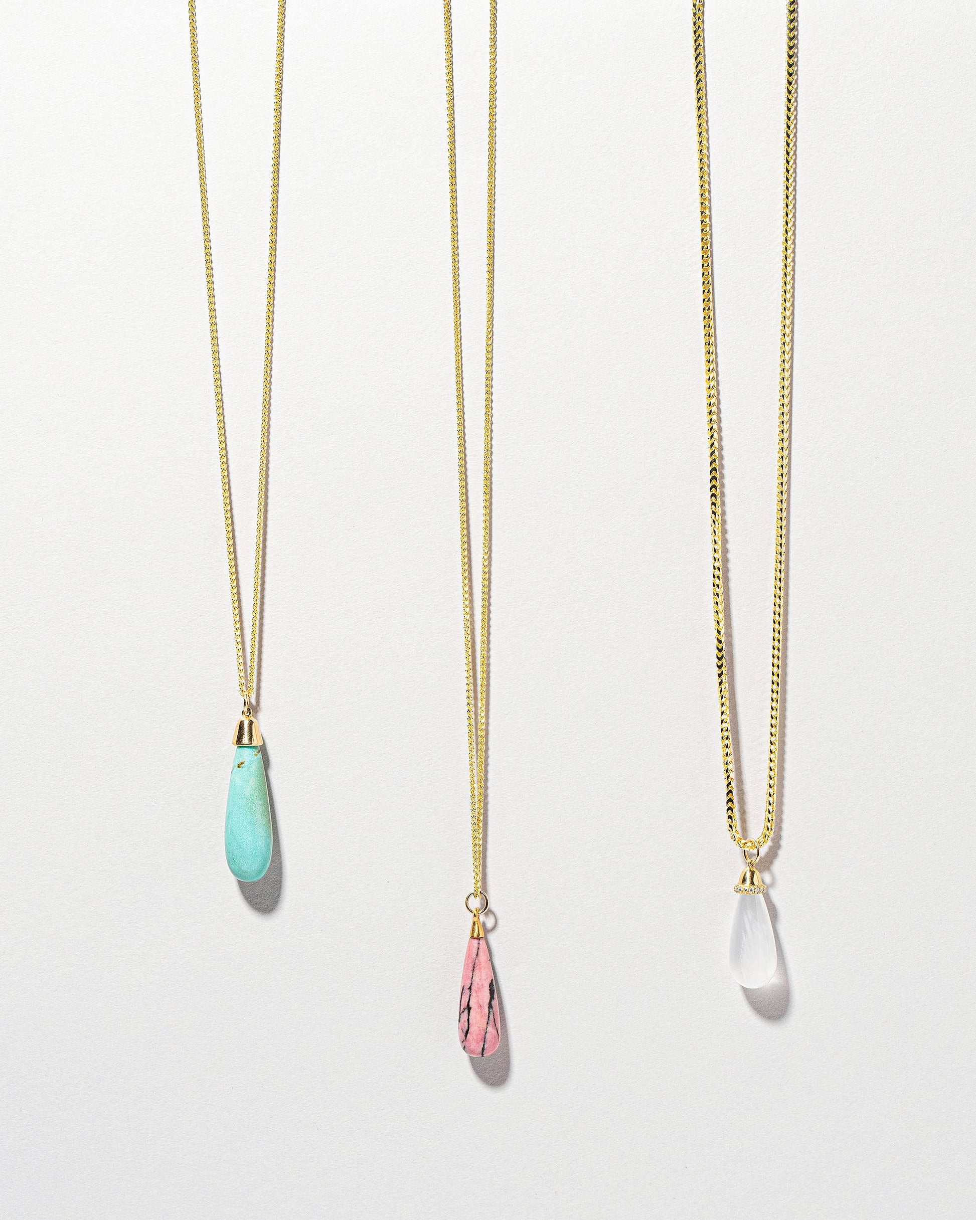  Turquoise Drop Pendant on light color background.