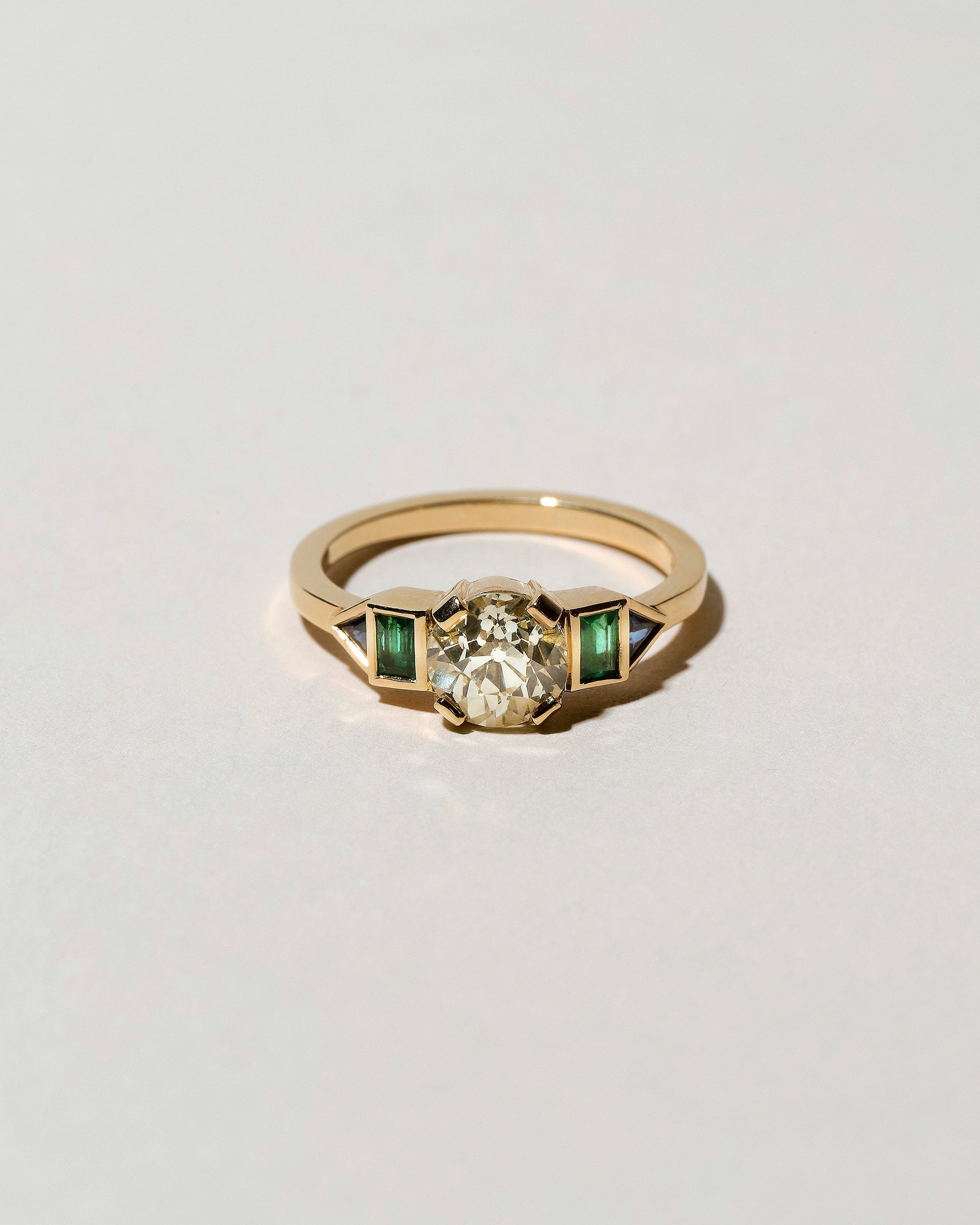  Five Stone Ring on light color background.