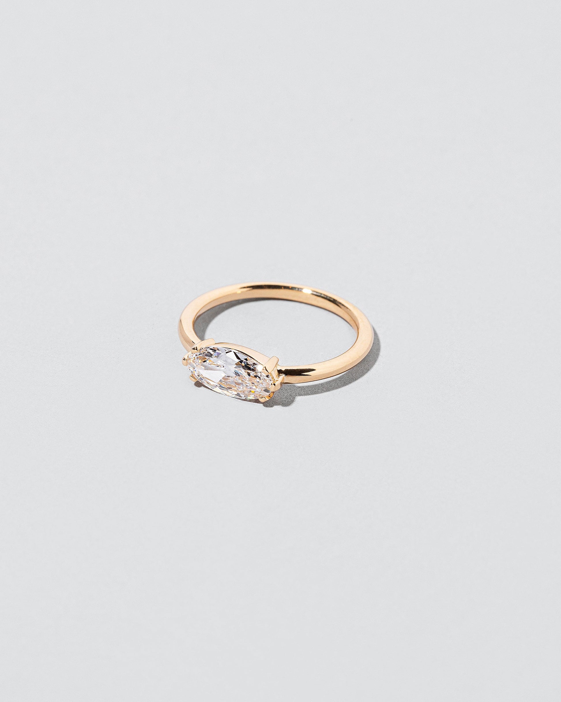  Elixer Ring on light color background.