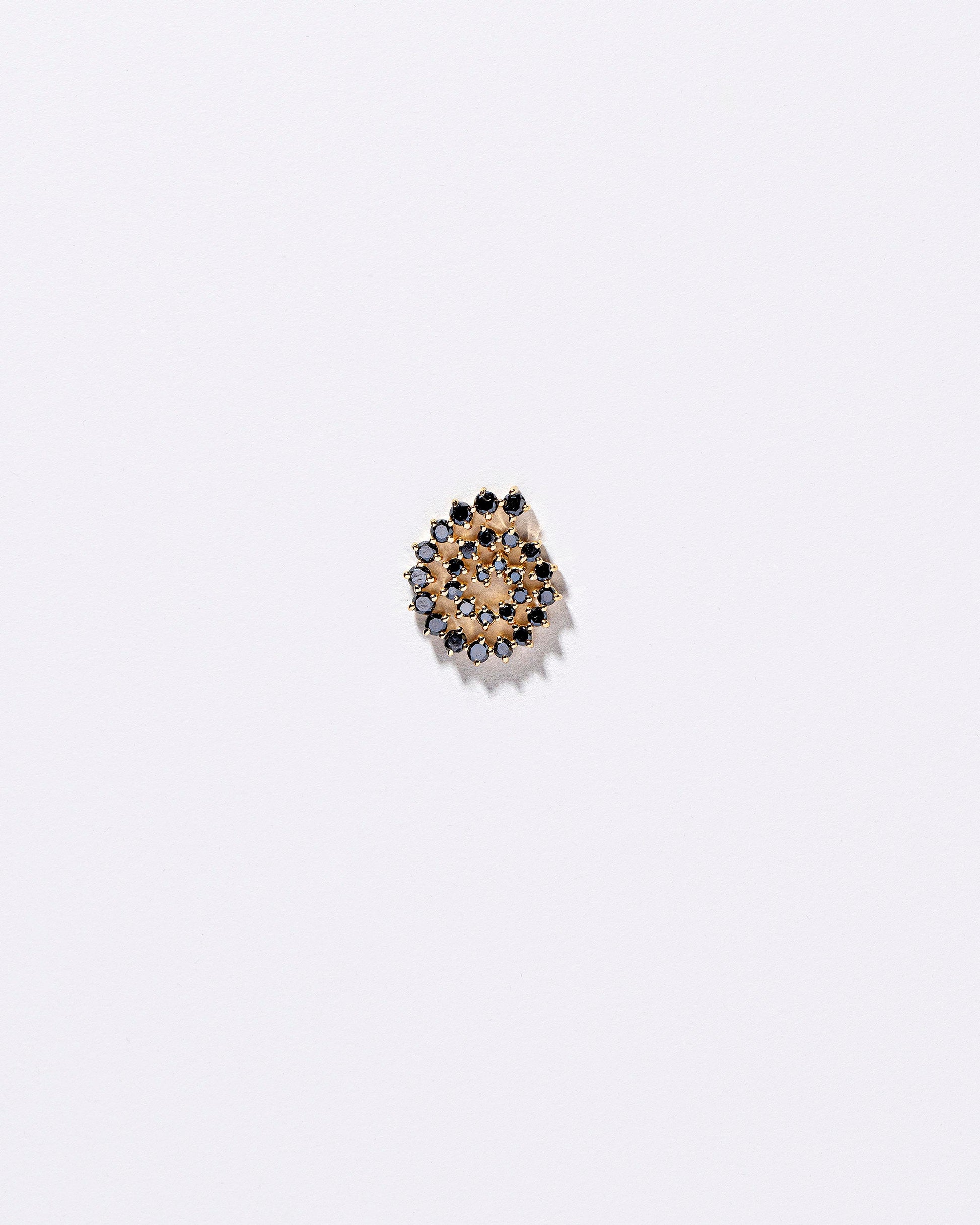 Full Black Diamond Right Spiral Stud Earring Single on light color background.
