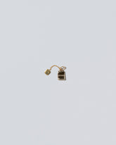 Tea Bag Charm on light color background.