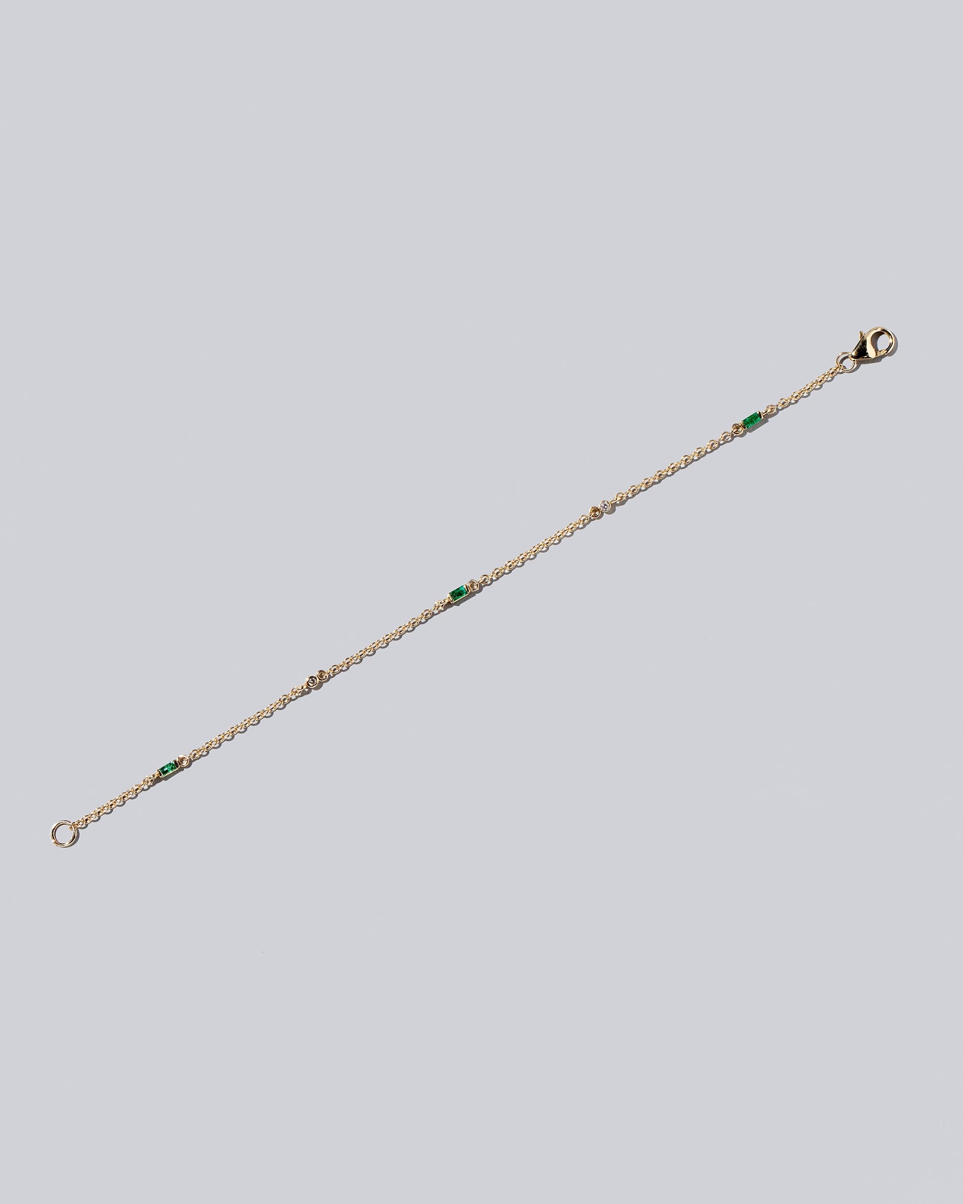 Emerald Distributed Building Blocks Bracelet on light color background.