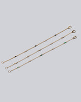 Group of Blue Sapphire, White Diamond and Emerald Distributed Building Blocks Bracelets on light color background.