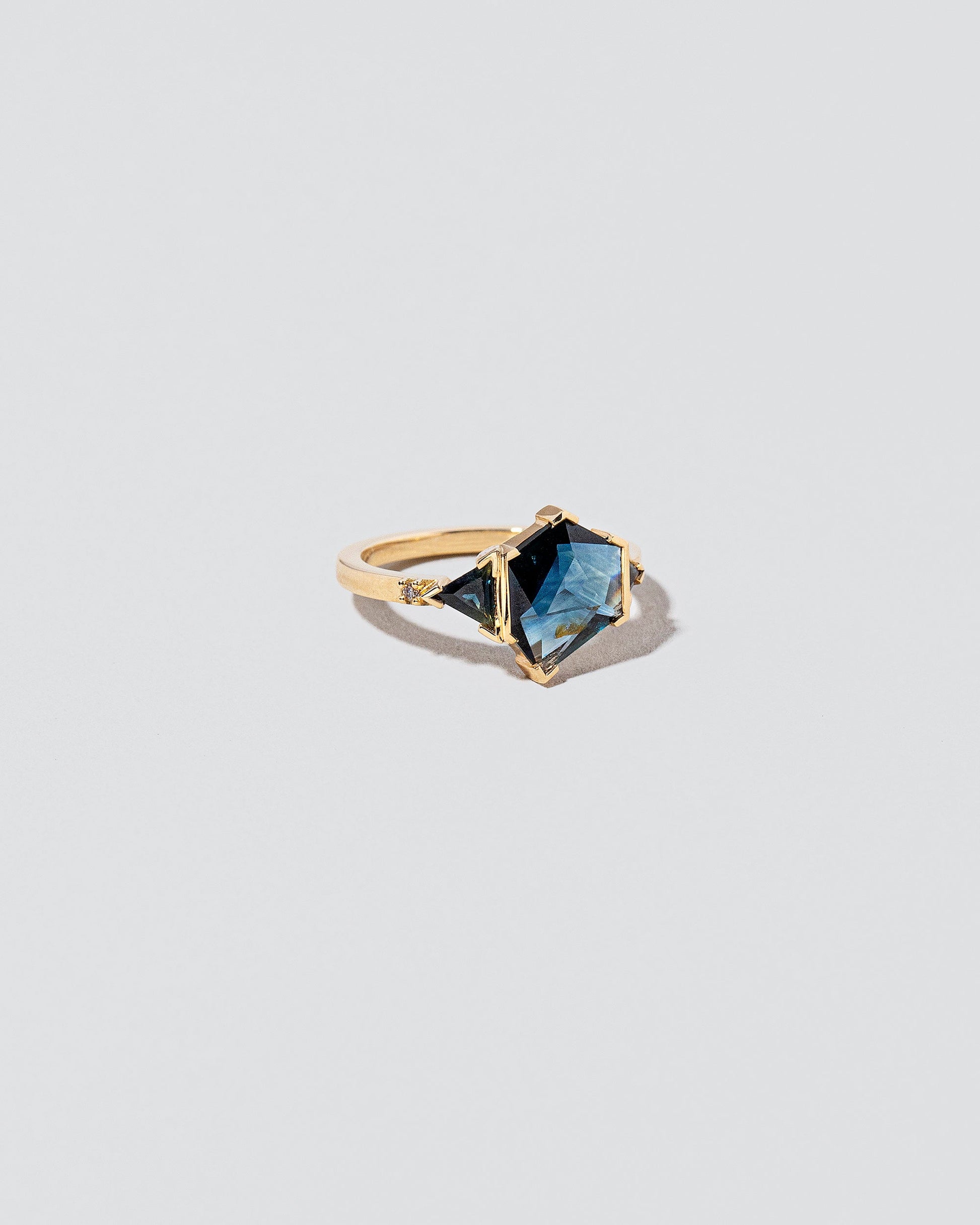 View from the side of the Side by Side Ring on light color background.