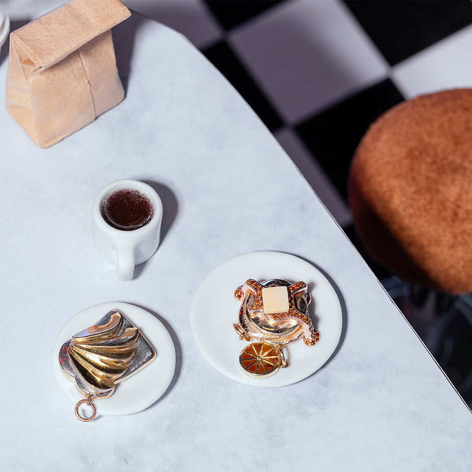 product_details::Styled image featuring the Avocado Toast Charm, Orange Slice Charm and Tall Stack Pancake Charm.