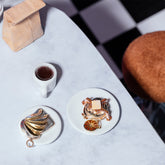 product_details::Styled image featuring the Avocado Toast Charm, Orange Slice Charm and Tall Stack Pancake Charm.