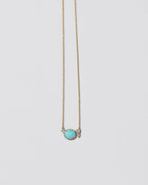 Rain Necklace on light color background.