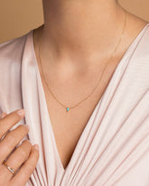 Gold Turquoise Triangle Necklace on model.