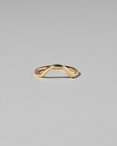 Gold Solid Round Wire Curve Band on light color background.