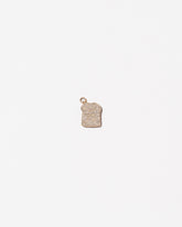 Pavé Toast Charm on light color background.