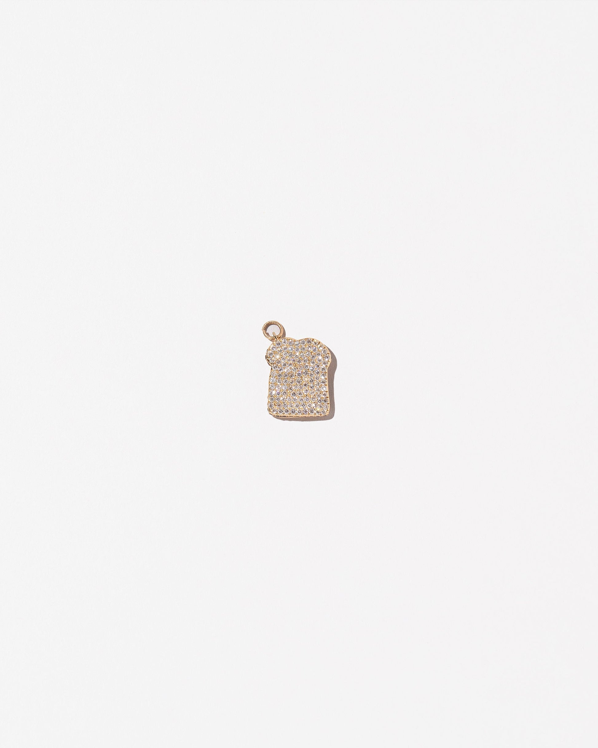 Pavé Toast Charm on light color background.