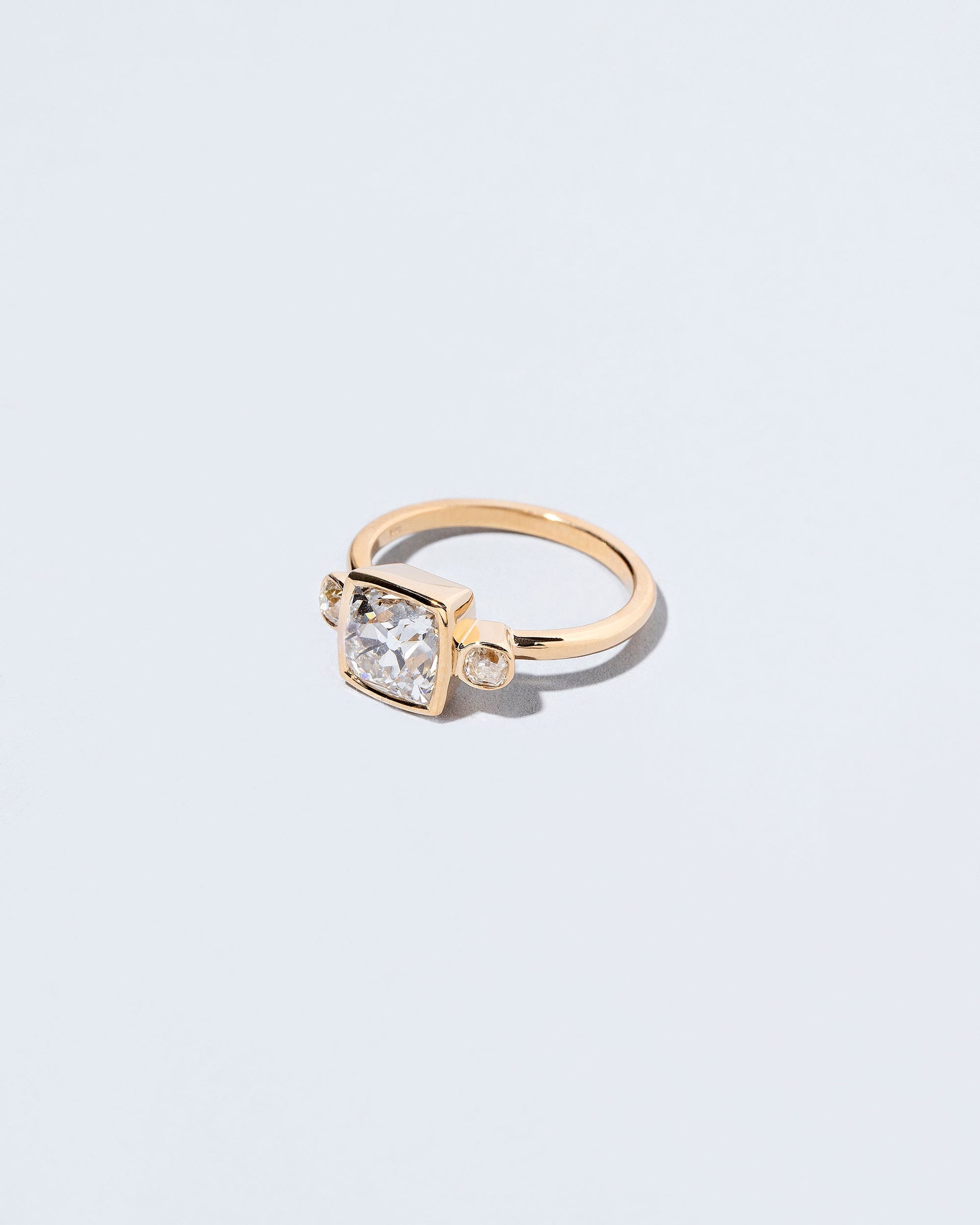  Genesis Ring on light color background.