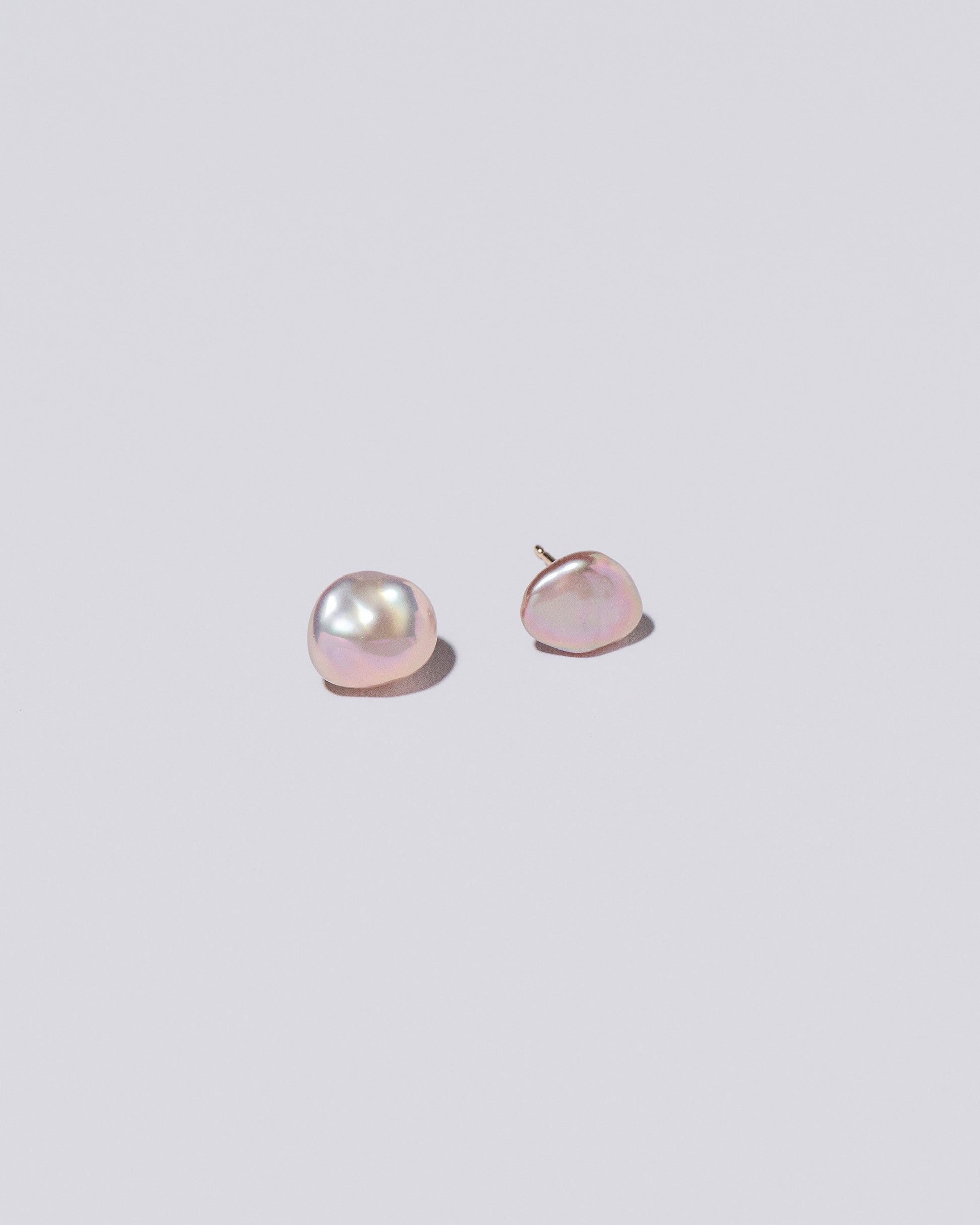  Lagniappe Pearl Stud Earrings on light color background.