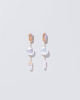  Theseus Earrings on light color background.