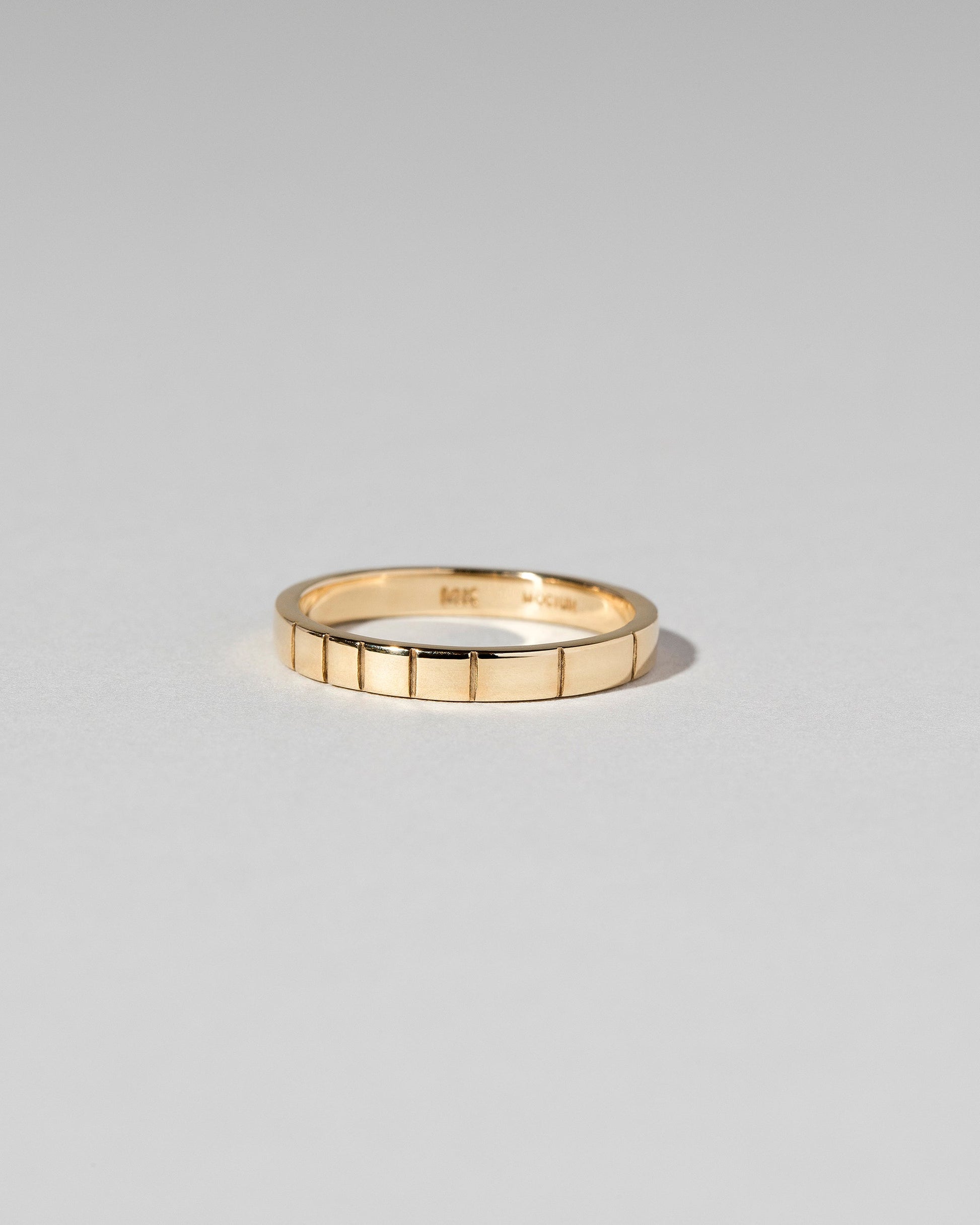 Gold 2.5mm Etched Lines Bands on light color background.