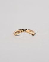 Gold White Diamond Single Stone Luna Peak Band on light color background.