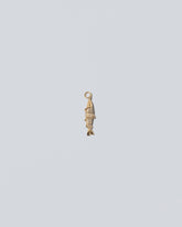 Pavé Fish Charm on light color background.