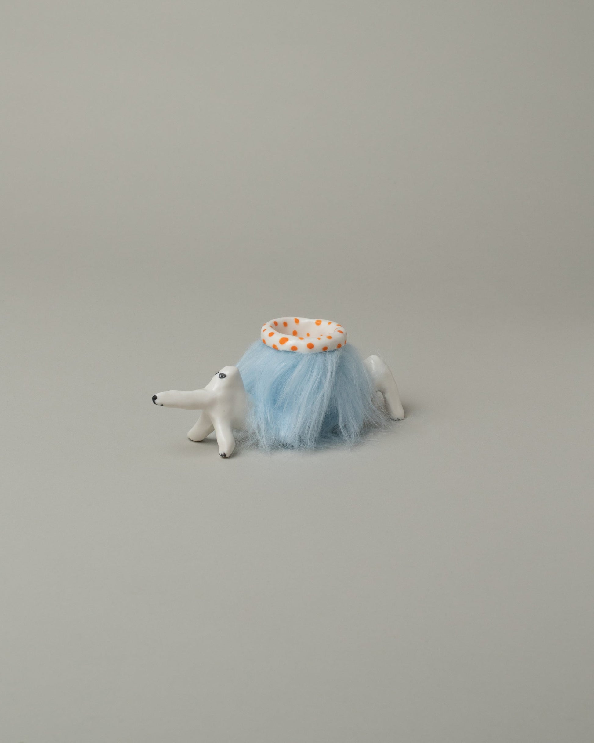 Eleonor Boström Orange Furry Baggage Dog on light color background.