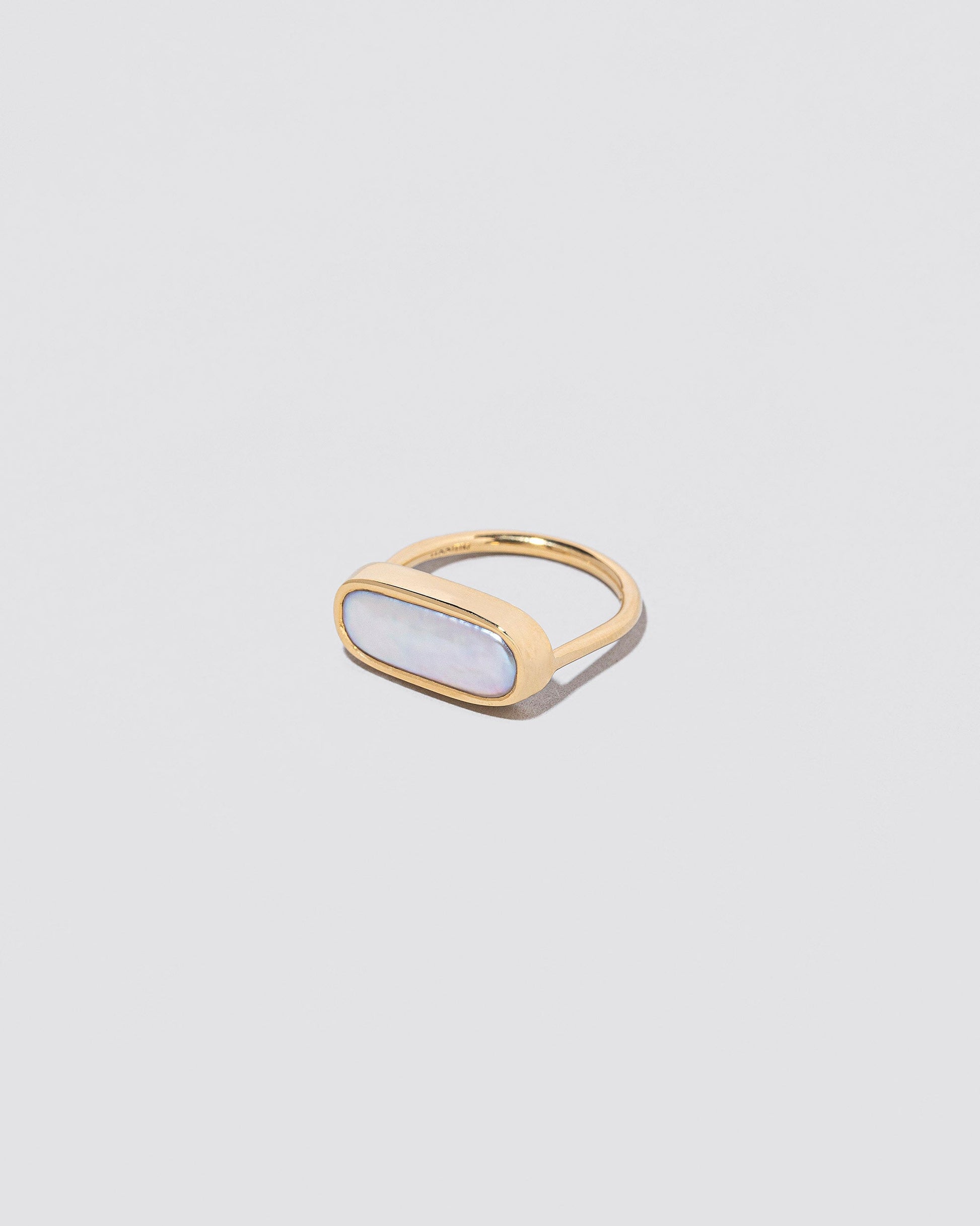 View from the side of the Antaeus Ring on light color background.