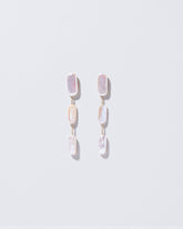  Pelias Earrings on light color background.