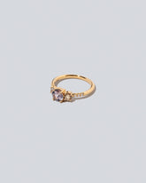 View from the side of the Purple Sapphire & Champagne Diamond Orion Ring on light color background.