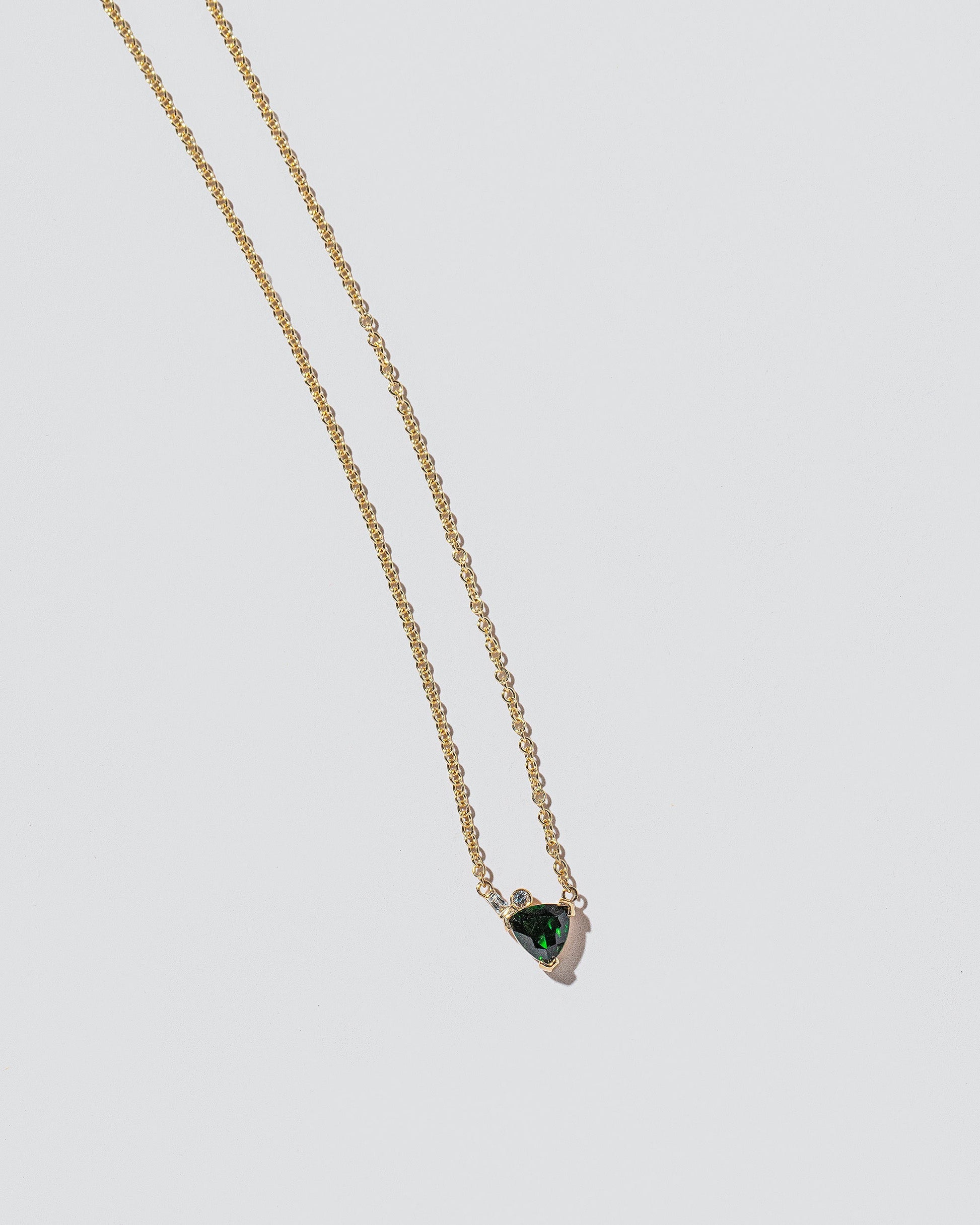  Rise Necklace on light color background.