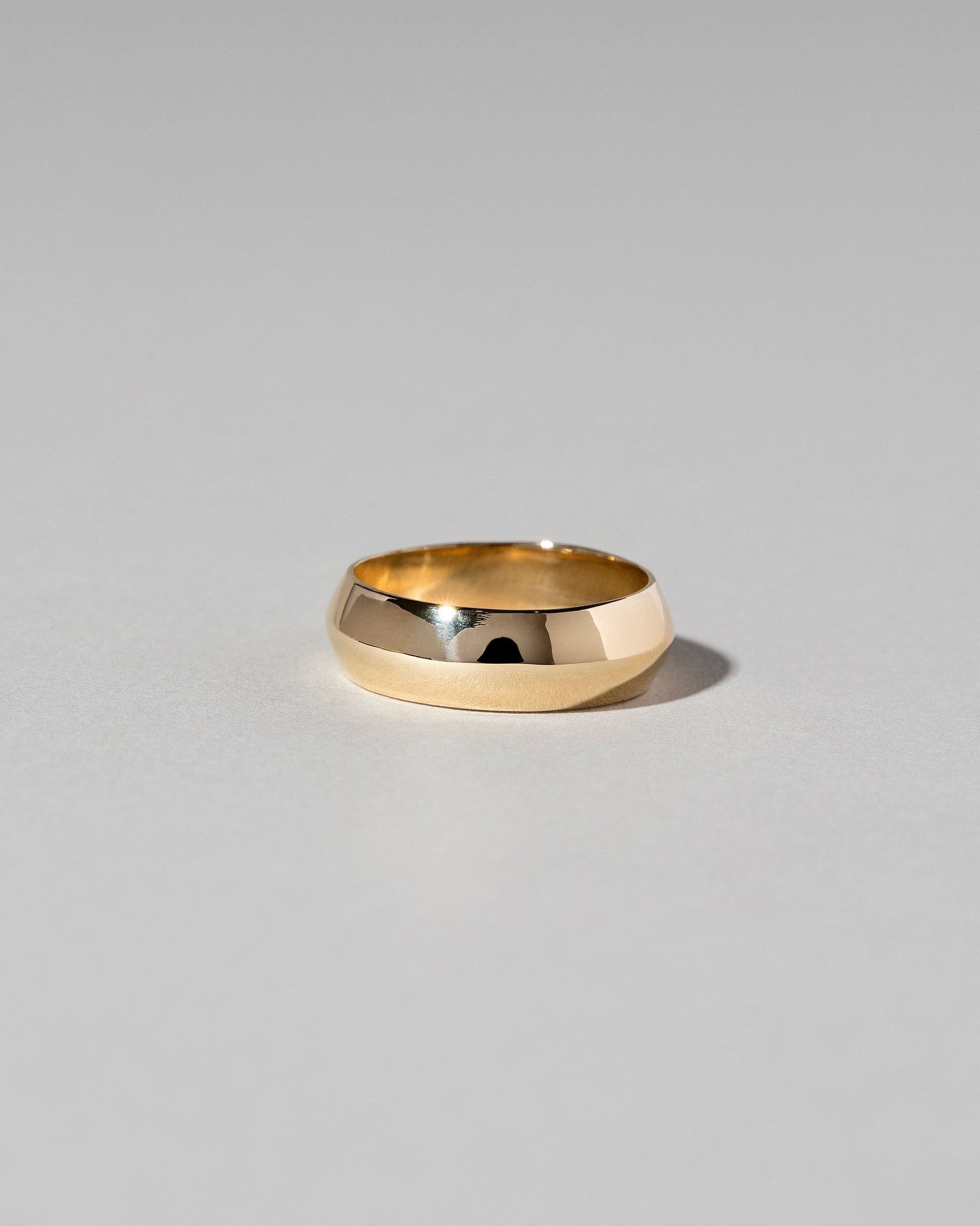 Gold 6mm Knife Edge Band on light color background.