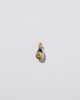 Deviled Egg Charm on light color background.