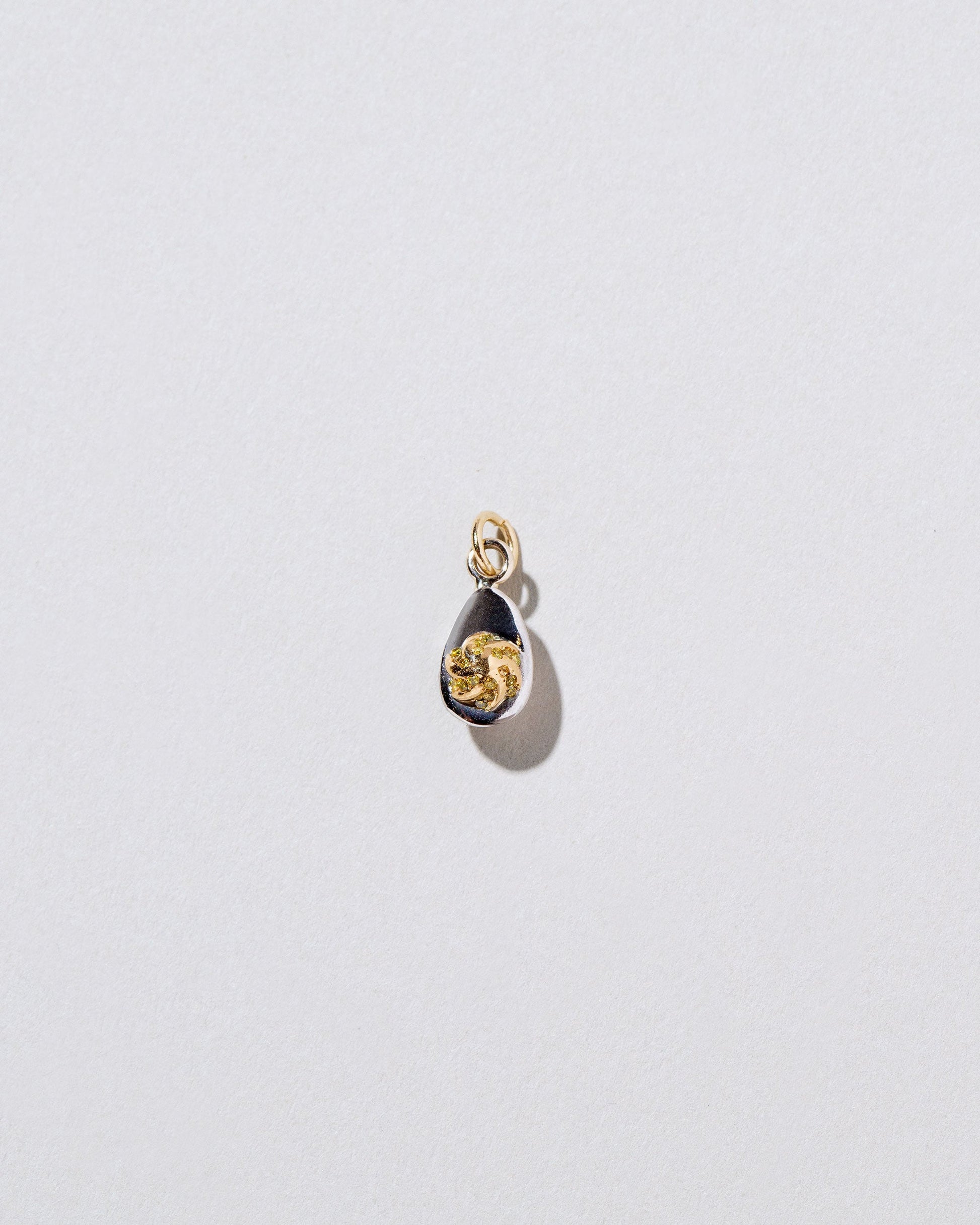Deviled Egg Charm on light color background.