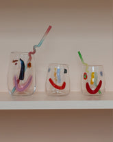 Group of FACEVESSEL Face Glasses on light color background.