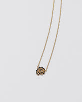Full Black Diamond Spiral Necklace on light color background.