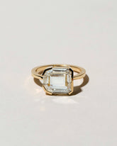 Shield Step Cut Diamond Ring on light color background.