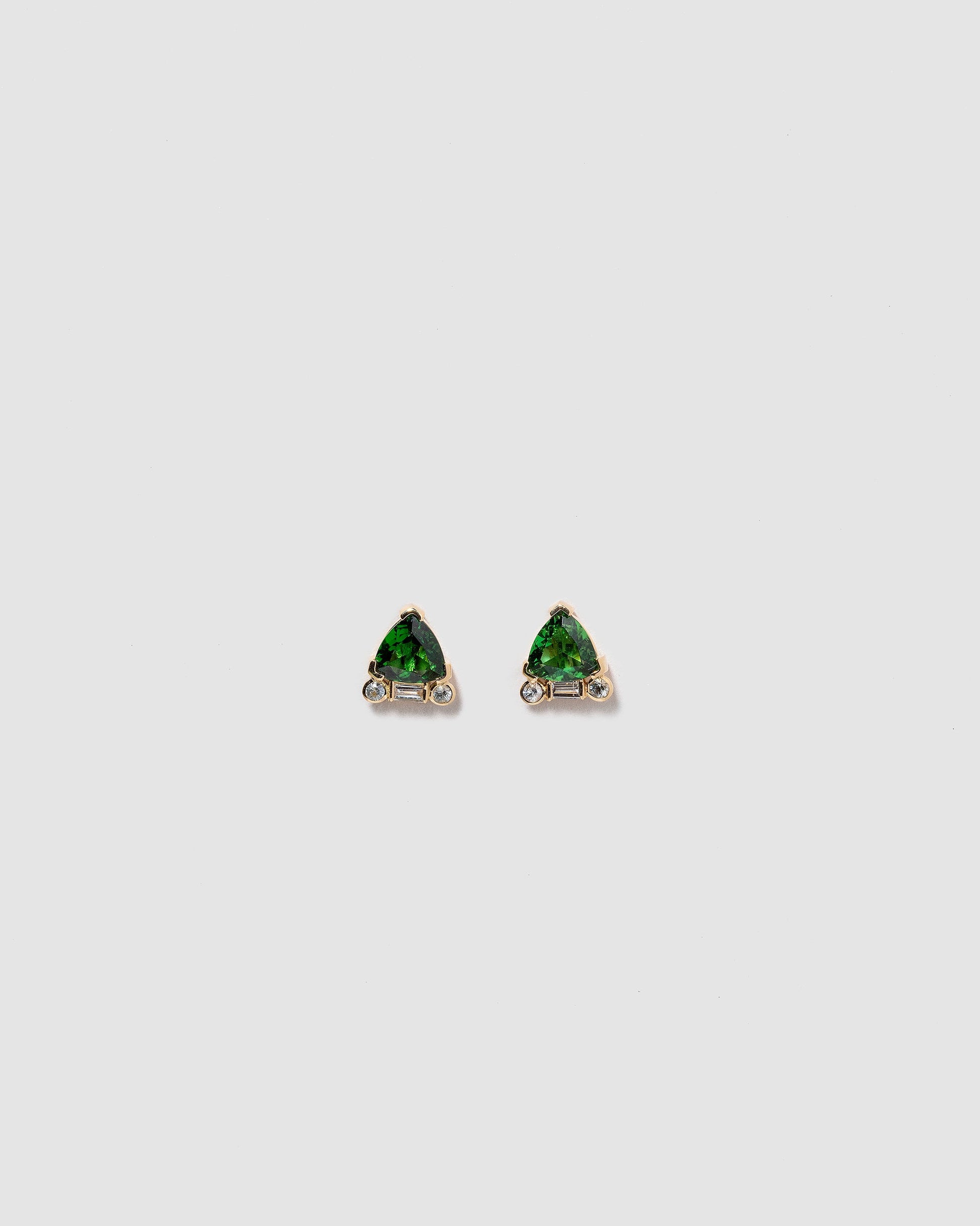  Rise Earrings on light color background.