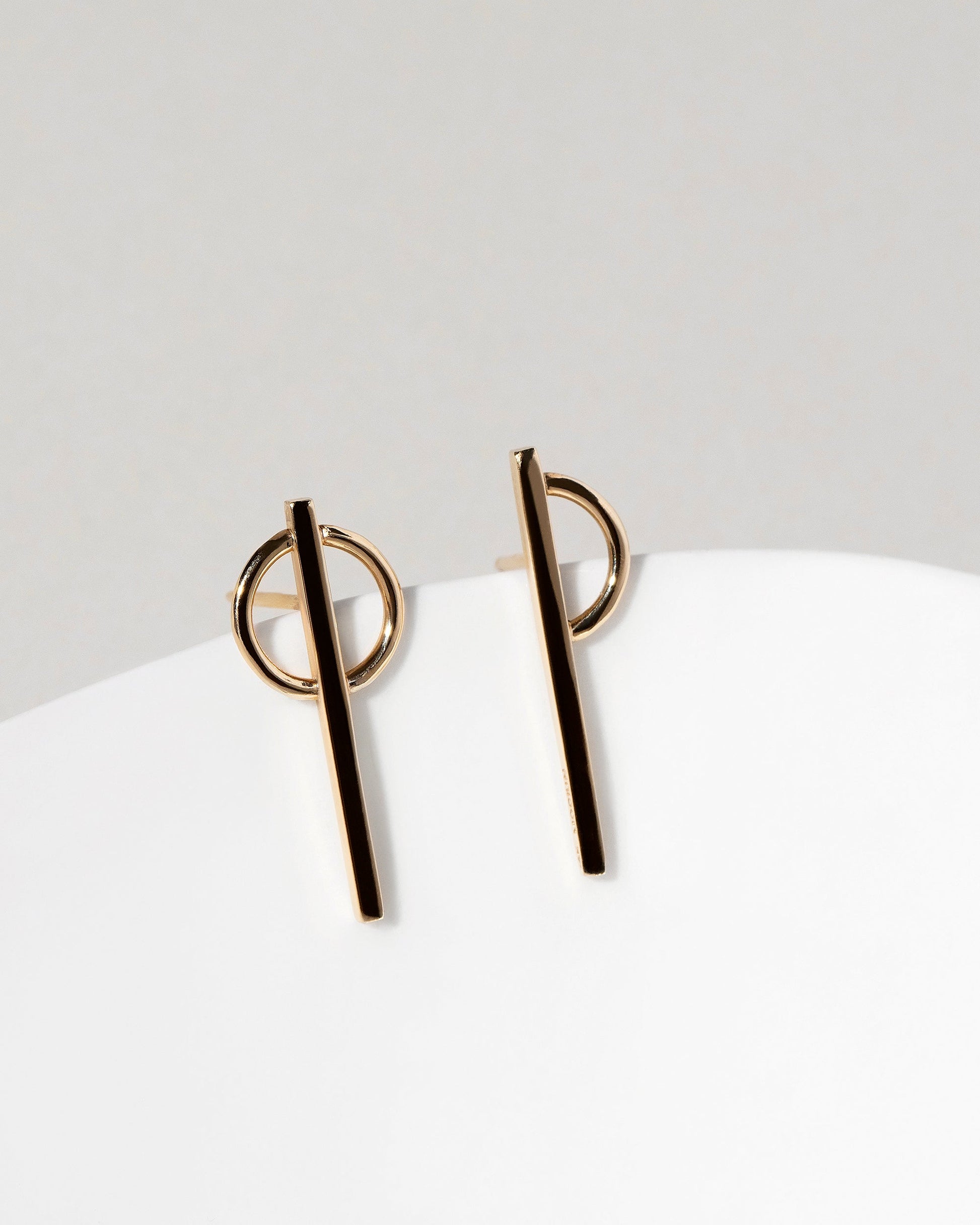  Stilt Dance Stud Earrings on light color background.