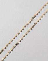  Streamer Chain Necklace on light color background.