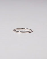 Platinum 1mm Half Round Band on light color background.